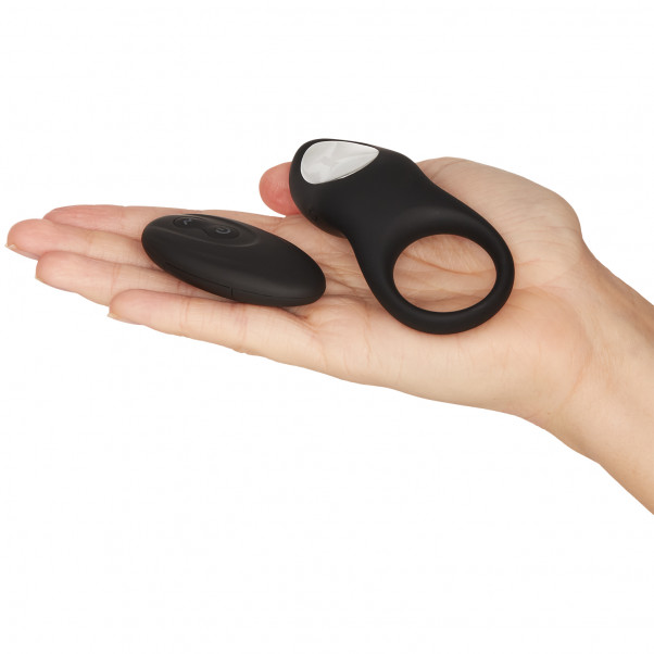 Sinful Love Buzz Rechargeable Remote Control Cock Ring product held in hand 50