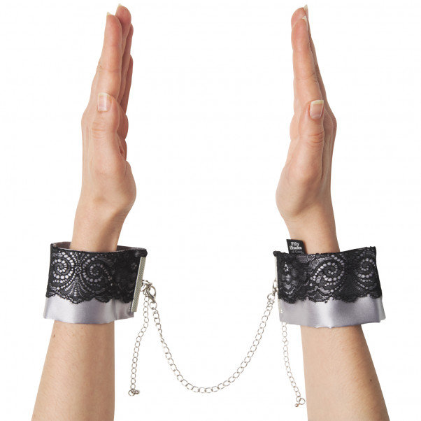 Fifty Shades Of Grey Play Nice Satin Wrist Cuffs product held in hand 50