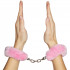 Baseks Plush Handcuffs product held in hand 50