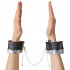 Fifty Shades Of Grey Play Nice Satin Wrist Cuffs product held in hand 50